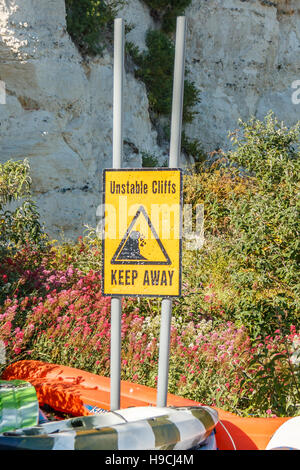 Unstable Rocks Sign Safety warning sign unstable rocks at Hopewell Rocks Provincial Park in ...