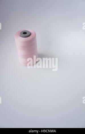 Pink Thread Bobbin A pink cotton thread bobbin Stock Photo - Alamy
