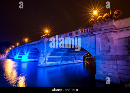 Kingston Upon Thames bridge at night, lit with blue light Stock Photo