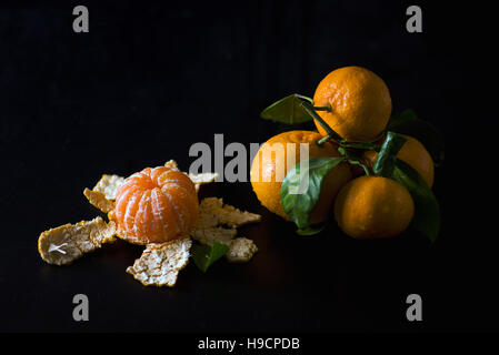 Mandarins still life image on a black background. Stock Photo