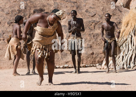 Damara People in traditional clothes are singing and dancing at The Living Museum of the Damara, Namibia Stock Photo