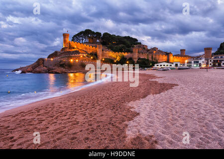 Spain, Costa Brava, Tossa de Mar at dusk, Platja Gran, main beach at Mediterranean Sea and castle - walled Old Town Stock Photo