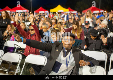 The multiracial faithful gather in Mission Viejo, CA, for an nighttime open air prayer service as part of The National Day of Prayer, an annual day of observance held on the first Thursday of May, designated by the United States Congress, when people are Stock Photo