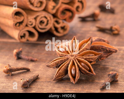 Star anise on wooden background Stock Photo