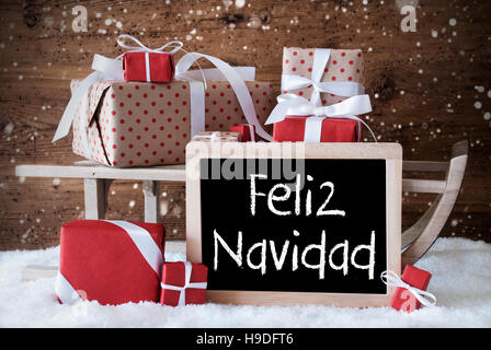 Sleigh With Gifts, Snow, Snowflakes, Feliz Navidad Means Merry Christmas Stock Photo