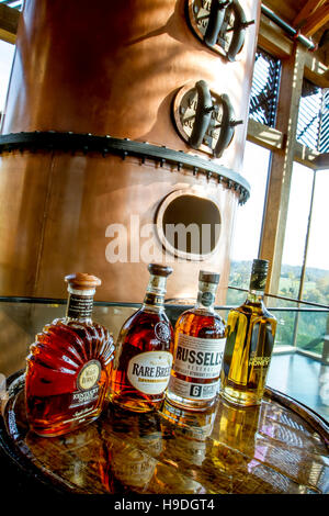 Lawrenceburg, KY, USA - October 19, 2016 : Wild Turkey Bourbons on table next to copper still inside visitors center. Stock Photo