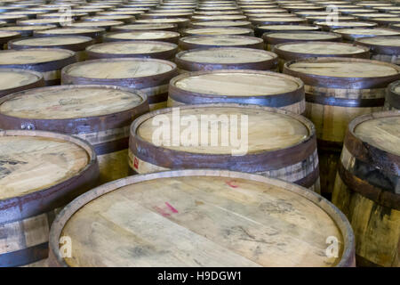 Used oak barrels in bottling facility of Kentucky distillery. Stock Photo