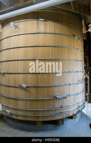 Oak barrel vat for fermentation in bourbon distillery. Stock Photo