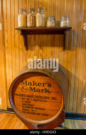 Loretto, KY, USA - October 21, 2016 : Maker's Mark barrel on display with glass jars of corn, wheat and rye. Stock Photo