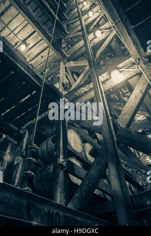 Inside the RIk or rack house with aging barrels of bourbon in black and white. Stock Photo