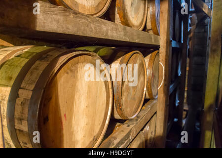 Bourbon barrels in rik house warehouse. Stock Photo