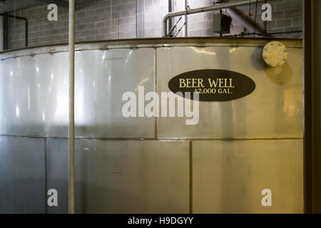 Large metal beer well for distillers beer inside bourbon distillery. Stock Photo