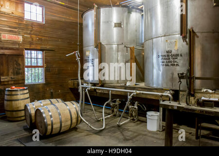 Barrel filling operations at craft bourbon distillery. Stock Photo