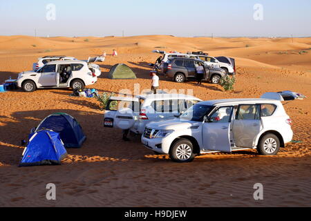 Four-wheel drives at a camp in the desert, Abu Dhabi Emirate, United Arab Emirates Stock Photo