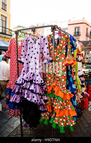 Flamenco dresses for sale on stall at Spanish street market Stock Photo