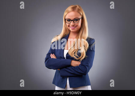 A beautiful young businesswoman standing confidently and wearing eyeglasses Stock Photo