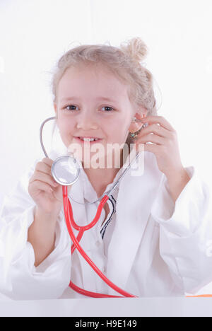 Seven-year-old girl dressed up as a doctor Stock Photo
