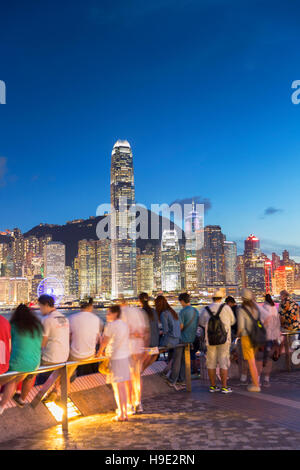View of Hong Kong Island skyline from Tsim Sha Tsui promenade at dusk, Hong Kong, China Stock Photo
