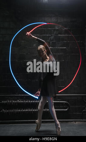 Young ballet dancer performing with a gymnastic ribbon Stock Photo