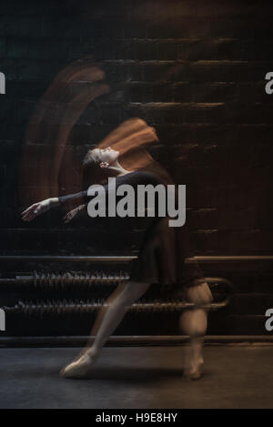 Flexible dancer dancing on the dark background Stock Photo