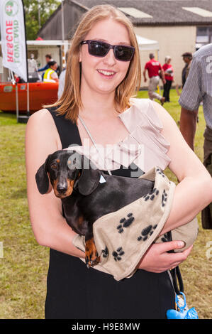 A girl holding her dog at the Royal Norfolk Show in the Showground , Norwich , Norfolk , England , Britain , Uk Stock Photo