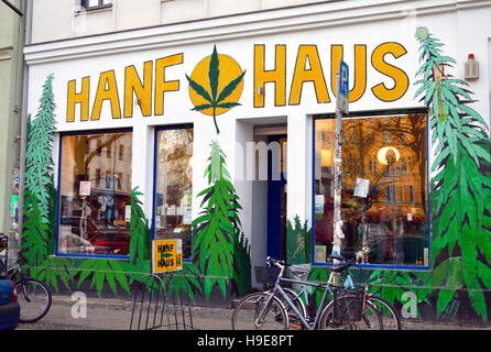 Front of a shop in Berlin Kreuzberg district selling hemp products, vibrant and colourful graffiti/ wall art, Berlin, Germany Stock Photo