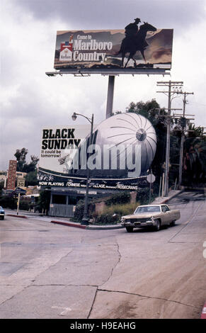 Billboards on the Sunset Strip in Los Angeles promoting Marlboro Cigarettes and the movie Black Sunday circa 1977 Stock Photo