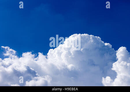 White creamy clouds with beautiful blue sky background. Stock Photo