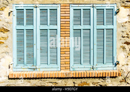 Mediterranean window with turquoise blue shutters in the South of France hilltop village of Gassin, Var, France Stock Photo