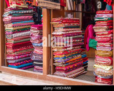 Colorful bolts of fabric at street shop in Nepal Stock Photo