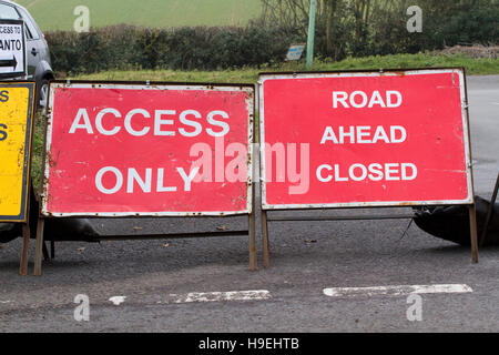 Multiple temporary road signs on a roundabout near Wickham Market Suffolk Stock Photo