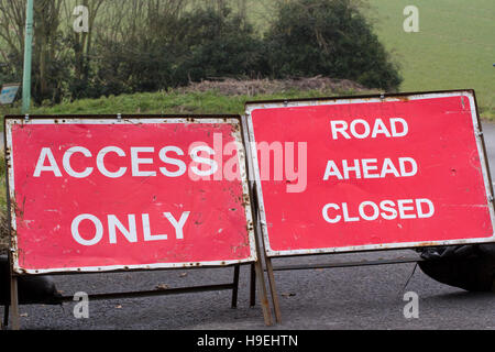 Multiple temporary road signs on a roundabout near Wickham Market Suffolk Stock Photo