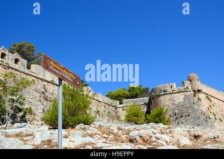 View of the Venetian castle walls with a sign in the foreground, Rethymno, Crete, Greece, Europe. Stock Photo