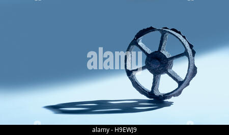 Rusty wheel casting shadow Stock Photo