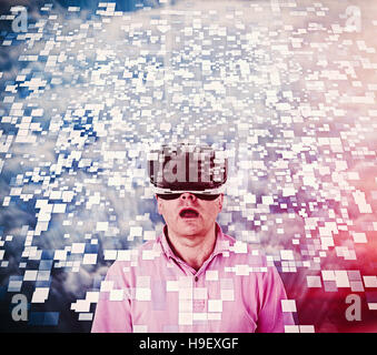 Caucasian man using vr goggles watching floating pixels Stock Photo