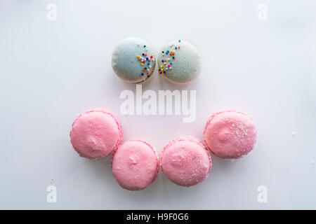 Macaroons forming smiley face Stock Photo