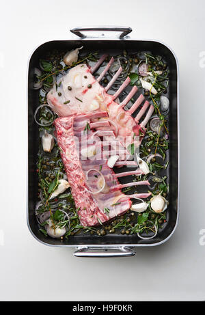 Raw racks of lamb in pan Stock Photo