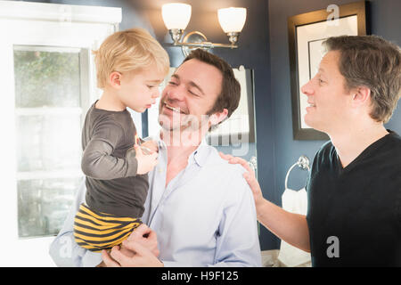 Caucasian fathers comforting son Stock Photo