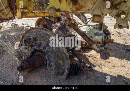 Massive axle of abandoned harvester rusting away deep in the Namib Desert of Angola Stock Photo