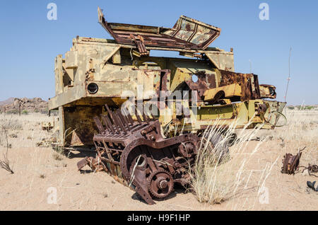 Abandoned harvester rusting away deep in the Namib Desert of Angola Stock Photo