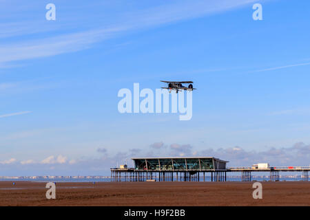 Royal Navy Fairey Swordfish biplane with Southport pier in the background  September 2015 Stock Photo