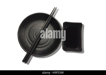 Top view of chopsticks with empty bowl Japanese sushi chopsticks and soy sauce bowl on white background. Stock Photo