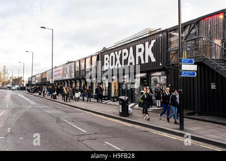 People walking at the BOXPARK, a cool pop up shopping venue with several indie shops and bars in Shoreditch, London, UK. Stock Photo