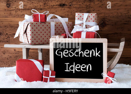 Sleigh With Gifts On Snow, Geschenk Ideen Means Gift Ideas Stock Photo