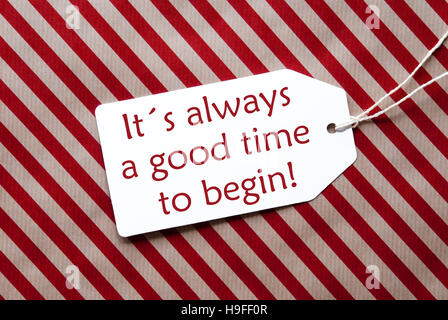 Label On Red Wrapping Paper, Quote Always Time Begin Stock Photo