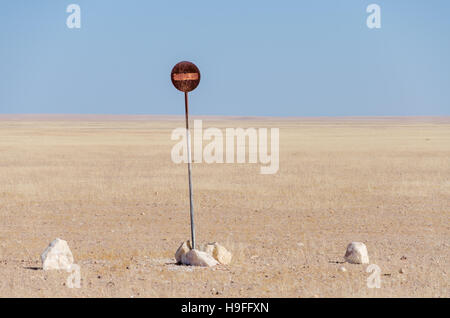 No entry or passage prohibited sign in the middle of the Namib Desert isolated in front of blue sky Stock Photo