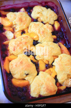 Overhead view of fresh peach and blueberry cobbler Stock Photo