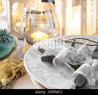 Christmas setting with decorations , ribbon and lanterns Stock Photo