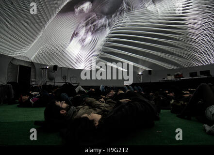 Couple looking at a projection in a dome of 360 degrees in a electronic music festival in Barcelona. Stock Photo