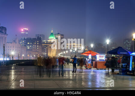 People walking on the promonade in Bund area of Shanghai, China. Stock Photo
